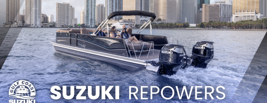 Pontoon boat in city bay with two Gulf Coast Suzuki outboard motors on the back.