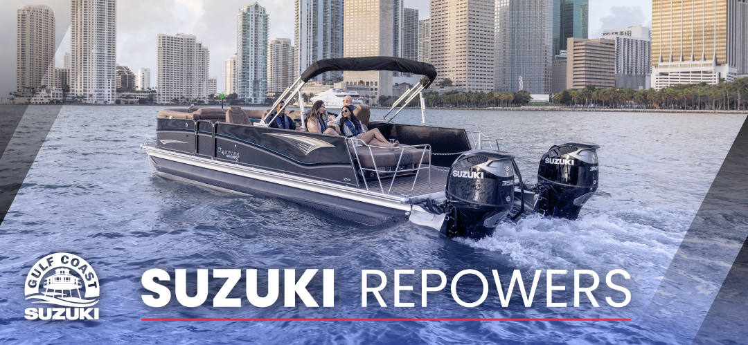Pontoon boat in city bay with two Gulf Coast Suzuki outboard motors on the back.